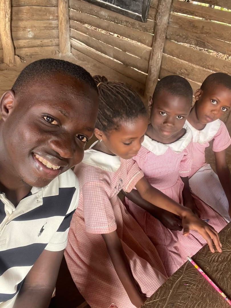 Ugandan students walking in school uniforms outdoors